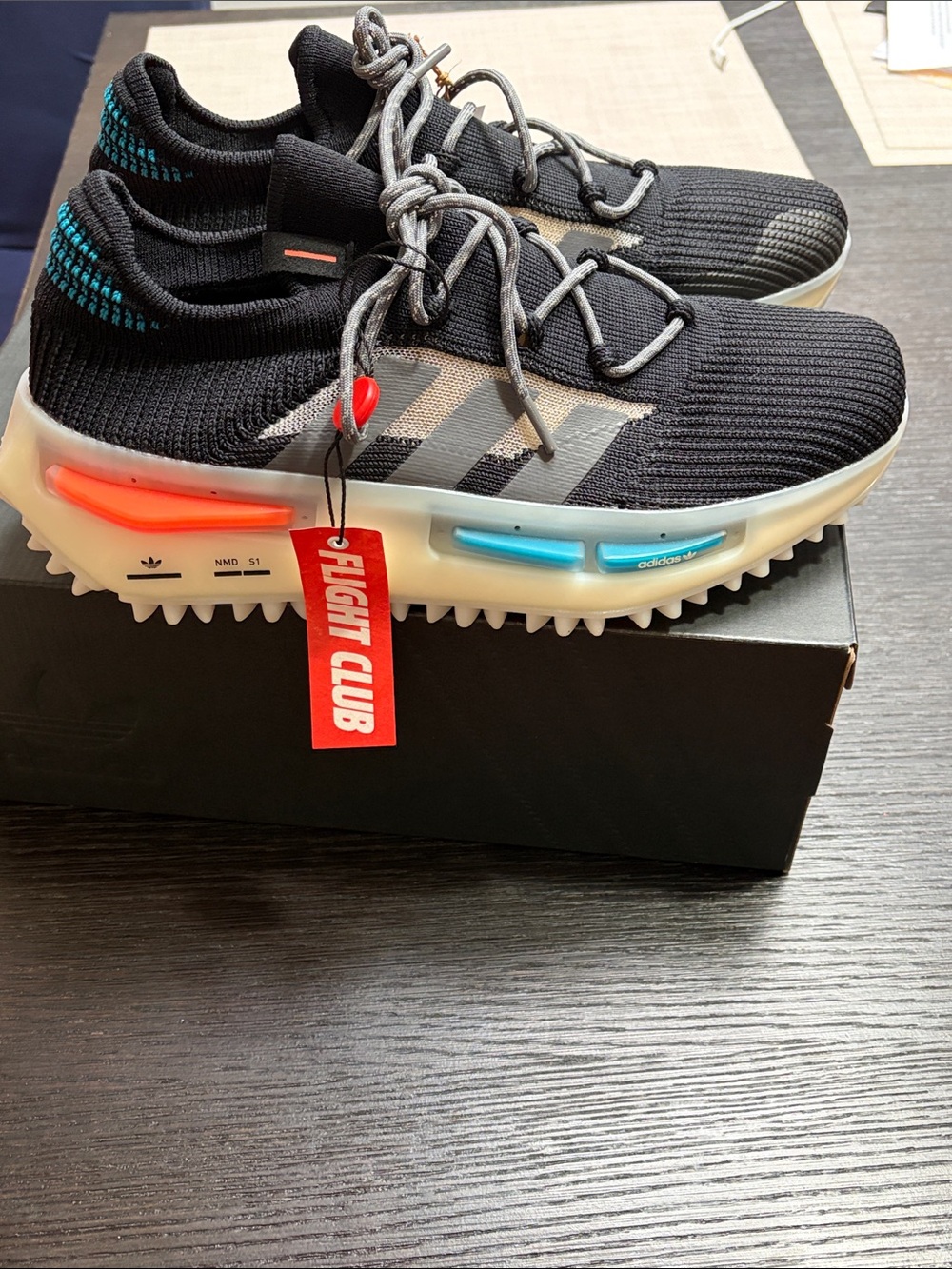adidas NMD S1 Men’s Black Knit Sneakers with Blue & Orange Accents